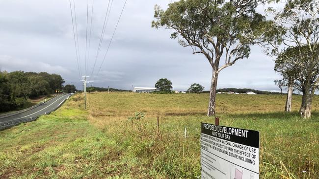 A development application billboard on land next to the existing building site on Serpentine Creek Road at Redland Bay advertising the project’s next stage.