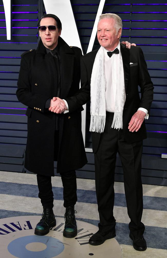 Unlikely friends Marilyn Manson and Jon Voight attend the 2019 Vanity Fair Oscar Party. Picture: Dia Dipasupil/Getty Images