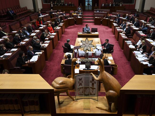 The Emu and the Kangaroo of the Australian Coat of Arms look down on the Senate chamber during Question Time at Parliament House in Canberra, Thursday, August 23, 2018. (AAP Image/Lukas Coch) NO ARCHIVING