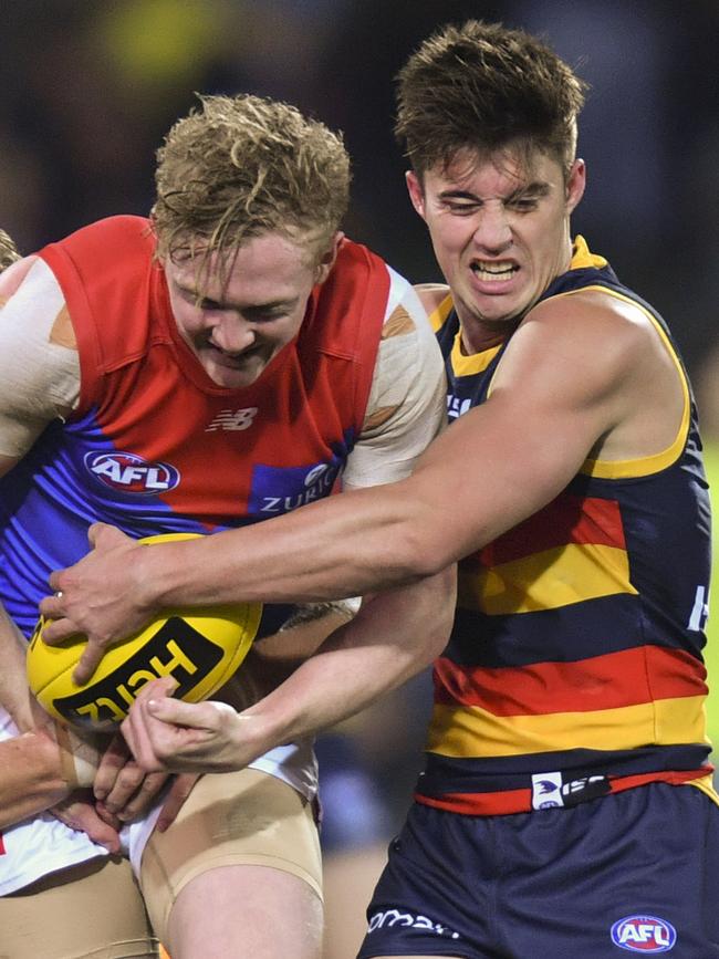 Riley Knight tackles Demon Clayton Oliver. Picture: SAM WUNDKE (AAP).