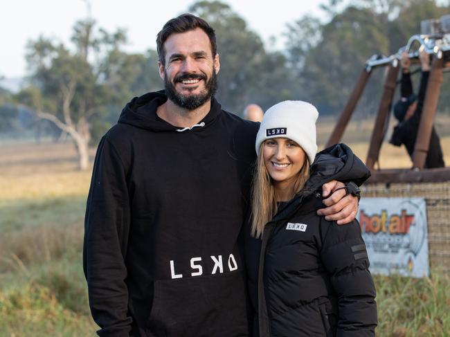 Locky Gilbert, with girlfriend Irena Srbinovska, took a hot air balloon to skydive over the Gold Coast Hinterland in local Gold Coast activewear brand, LSKD.