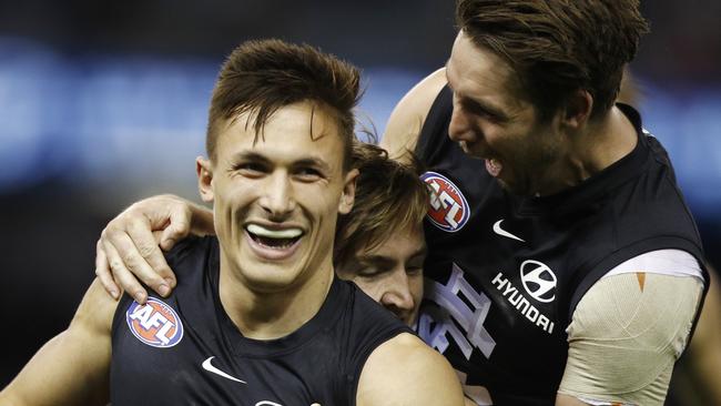 Josh Deluca of the Blues (left) celebrates a goal during the Round 18 AFL match between the Carlton Blues and the Gold Coast Suns at Marvel Stadium in Melbourne, Saturday, July 20, 2019. (AAP Image/Daniel Pockett) NO ARCHIVING, EDITORIAL USE ONLY