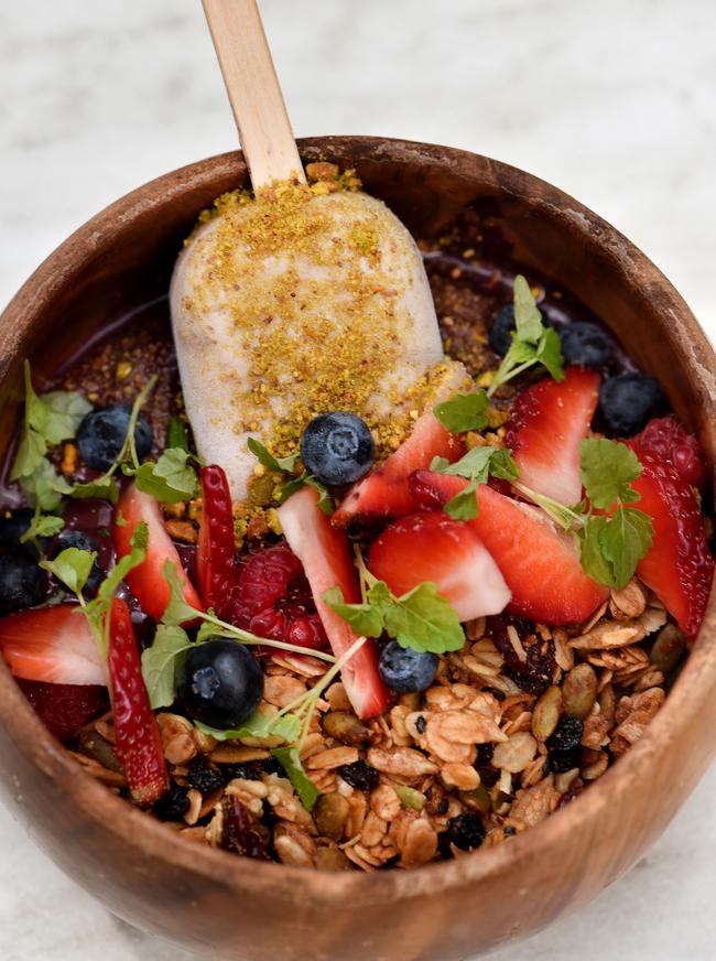 Dairy and sugar-free acai ice-cream topped with nuts, buckwheat and dried fruit granola served with a peanut butter and coconut magnum at Serotonin Eatery. Picture: Jay Town