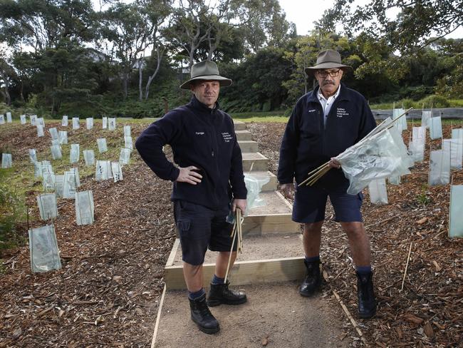 Rangers Luca Petroncini and Frank Thompson show examples of the vandalism. Picture: David Swift