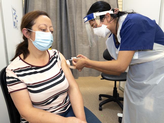 MELBOURNE, AUSTRALIA - NewsWire Photos NOVEMBER 5, 2021: Afaf Kadar receives her second Covid vaccination at the Melbourne Showgrounds as Australia is expected to pass the 80 percent double vaxxed rate today. Picture: NCA NewsWire / David Geraghty