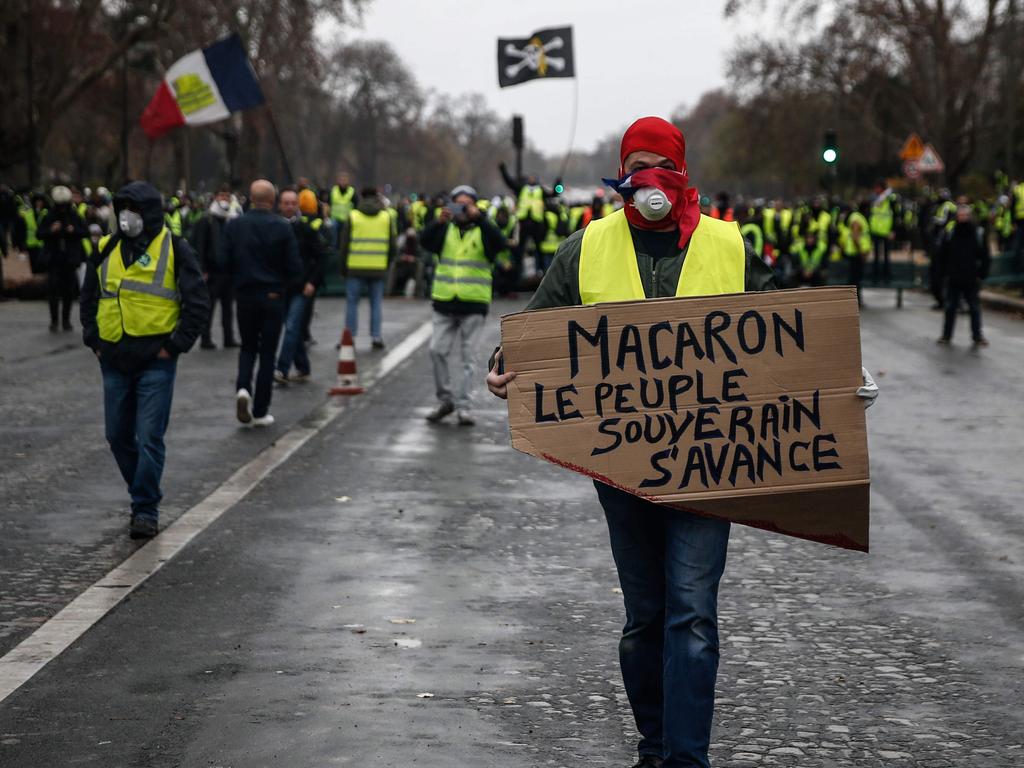 Yellow Vests protesters in Paris demonstrate against rising oil prices and living costs for the third week, challenging Macron’s leadership. Picture: Abdulmonam Eassa/AFP