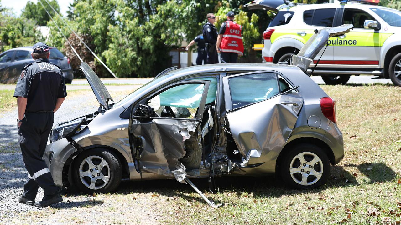 Emergency services personnel respond to a collision between a small car and a cane train at a level crossing on Beatrice Street, Mooroobool on Thursday October 17. Picture: Brendan Radke