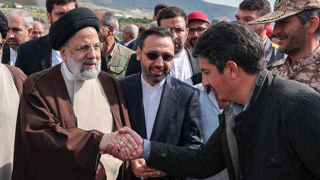 Iran's President Ebrahim Raisi with members of his delegation in Aras, in Azerbaijan, ahead of the inauguration ceremony for a dam project on the border between the two countries on Sunday. Picture: Iranian Presidency/AFP