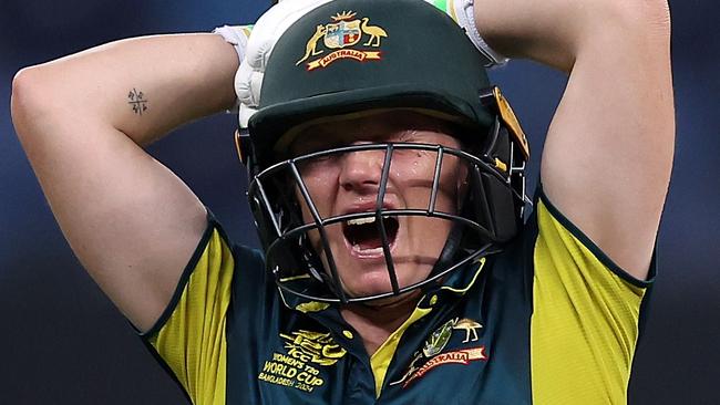 DUBAI, UNITED ARAB EMIRATES - OCTOBER 11: Alyssa Healy of Australia grimaces as she walks off after picking up an injury during the ICC Women's T20 World Cup 2024 match between Australia and Pakistan at Dubai International Stadium on October 11, 2024 in Dubai, United Arab Emirates.  (Photo by Alex Davidson-ICC/ICC via Getty Images)