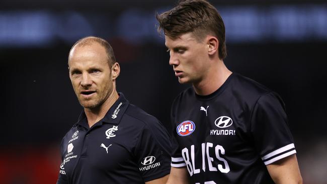 Carlton fitness coach Andrew Russell talks with Sam Walsh. Picture: Michael Klein