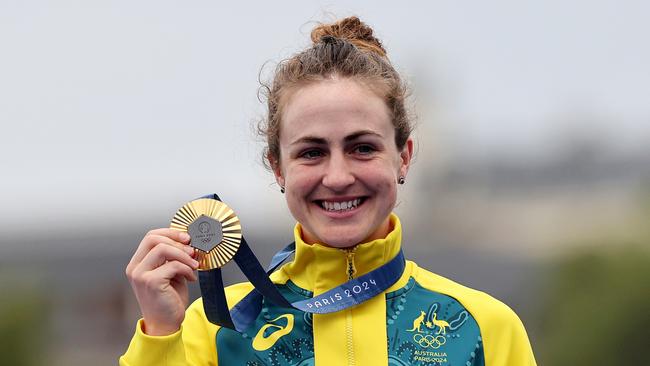 PARIS, FRANCE - JULY 27: Gold medalist Grace Brown of Team Australia poses on the podium during the Women's Individual Time Trial on day one of the Olympic Games Paris 2024 at Pont Alexandre III on July 27, 2024 in Paris, France. (Photo by Tim de Waele/Getty Images)