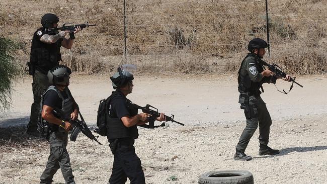 Israeli forces, dispatched to the border with Gaza in southern Israel, scan the area near Ashdod on October 8, 2023 as the battle against holdout Hamas fighters continues.Picture: AFP