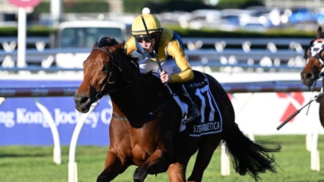 Stefi Magnetica and Zac Lloyd on their way to winning the Stradbroke Handicap at Eagle Farm on Saturday. Picture: Grant Peters/Trackside Photography.