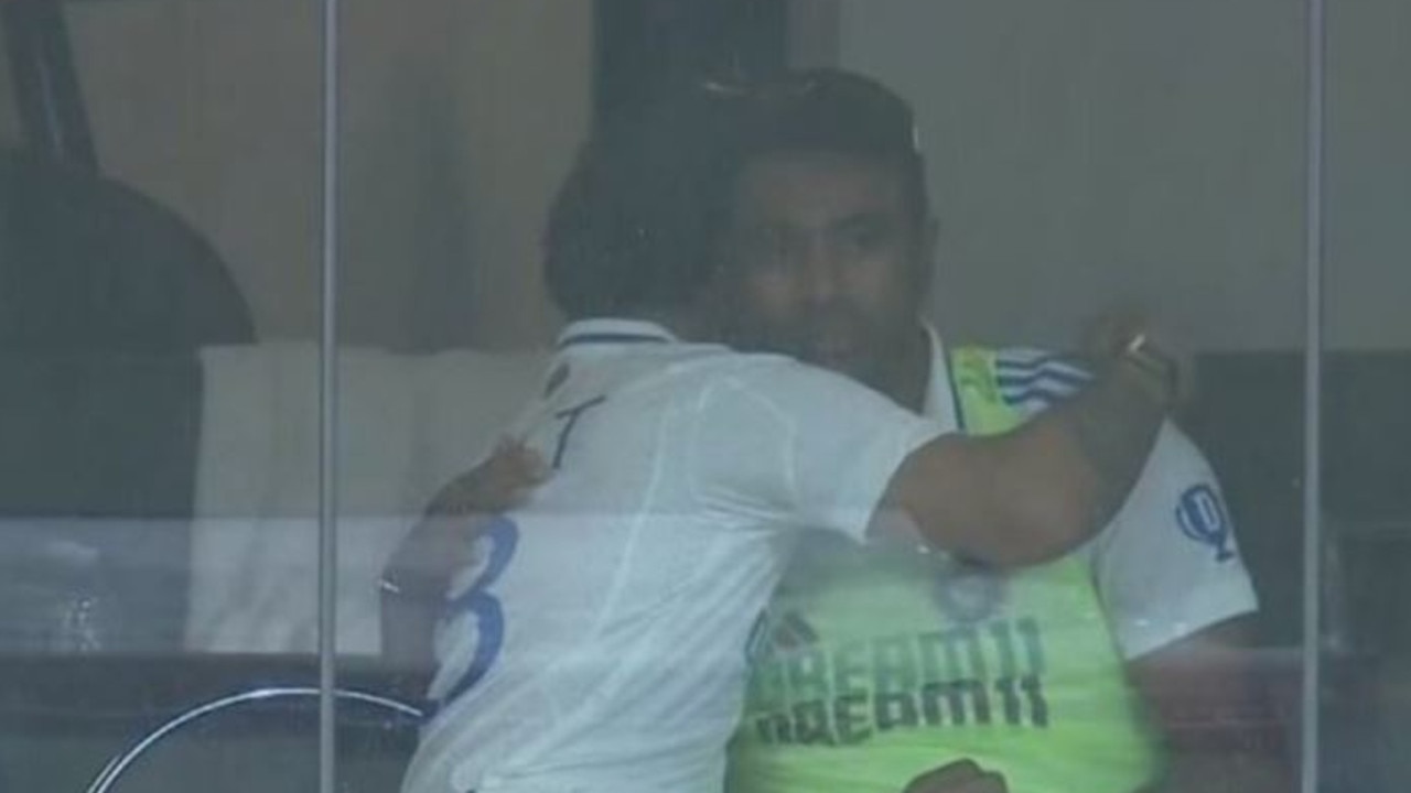 Ravi Ashwin is embraced in the Indian dressing room. Photo: Fox Cricket.