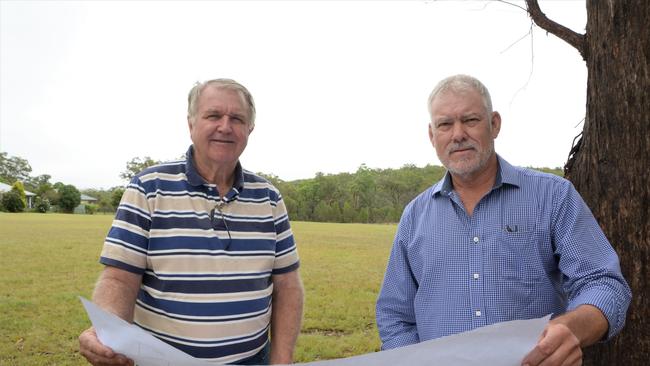 Crows Nest Community Solutions Ltd directors Jeff Close and Baden Brown surveys the plans for a new community and affordable housing project at the end of Creek Street in Crows Nest, dubbed Chaseley Park.