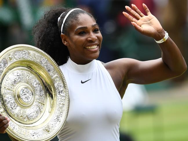 Serena Williams poses with the winner's trophy, the Venus Rosewater Dish, after her women's singles final victory over Germany's Angelique Kerber at the 2016 Wimbledon Championships. Picture: AFP