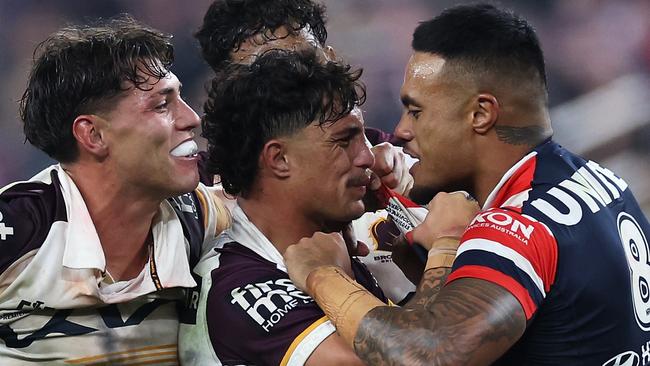 LAS VEGAS, NEVADA - MARCH 02: SpencerÃÂ Leniu (r) of the Roosters exchanges heated words with KotoniÃÂ Staggs of the Broncos during the round one NRL match between Sydney Roosters and Brisbane Broncos at Allegiant Stadium, on March 02, 2024, in Las Vegas, Nevada. (Photo by Ezra Shaw/Getty Images)