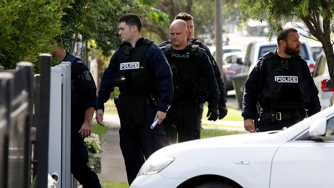 Police enter an address in Auburn as part of a crackdown on firearms. Picture: Jonathan Ng