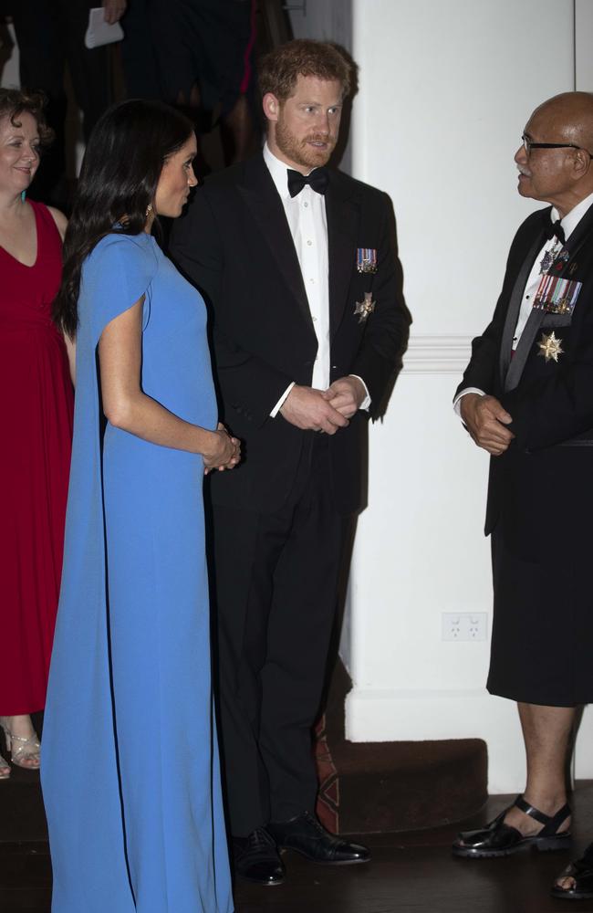 Meghan and Harry say hello to Fijian President Jioji Konrote. Picture: Ian Vogler