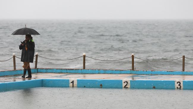 Bleak conditions marked the last weekend of school holidays at Sydney’s Dee Why Beach on the weekend. Picture: Damian Shaw