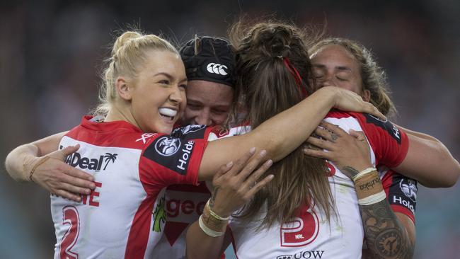 Dragons players celebrate at full-time after their win over the Warriors. Picture: AAP