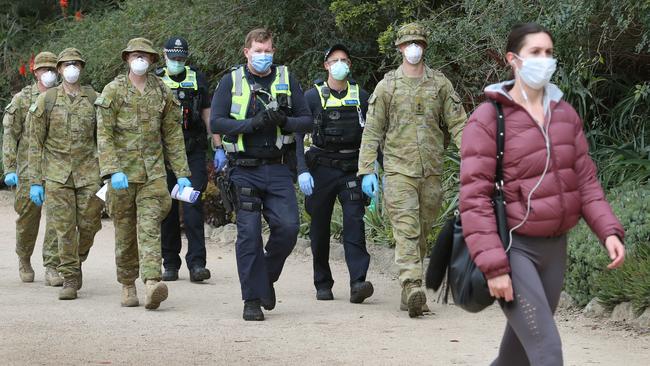 Members of the army and police patrol The Tan on day one of mandatory mask wearing in Melbourne. Picture: NCA NewsWire/David Crosling