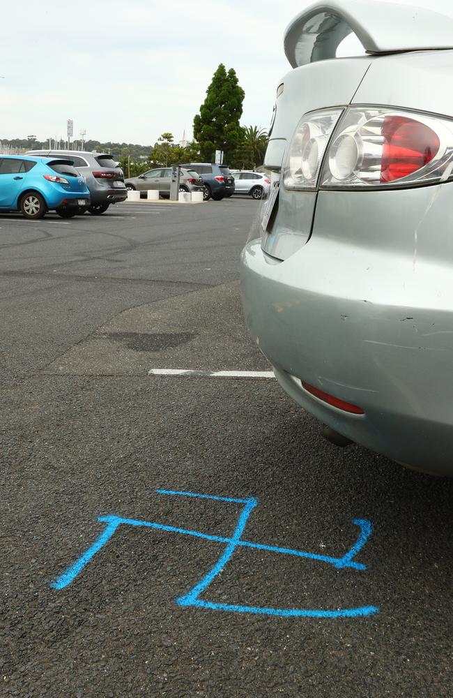 A swastika painted on the ground at Western Beach carpark. Picture: Alison Wynd