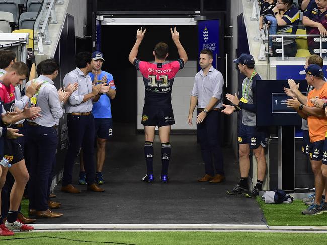 Gavin Cooper of the Cowboys waves to the crowd after playing his last home game for the Cowboys. Picture: Ian Hitchcock/Getty Images