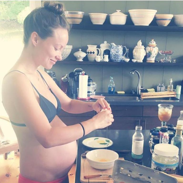 Olivia Wilde displays her growing baby bump as she get’s busy in the kitchen. Picture: Instagram