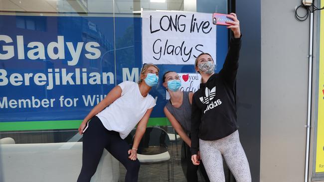 Female supporters posing outside Gladys Berejiklian’s office following her resignation. Picture: Richard Dobson