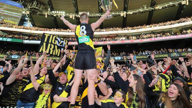 Jack Riewoldt gets a mighty roar from the Tiger faithful after the club won the 2019 flag.