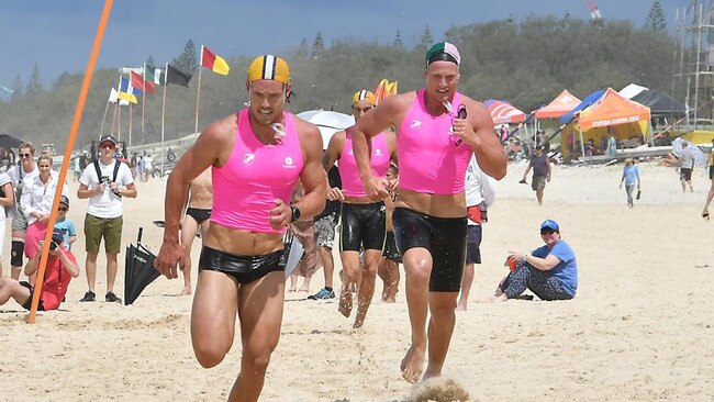 Tanyn Lyndon crosses the line first in the ironman race at the Queensland State surf life saving championships. Picture: Harvpix