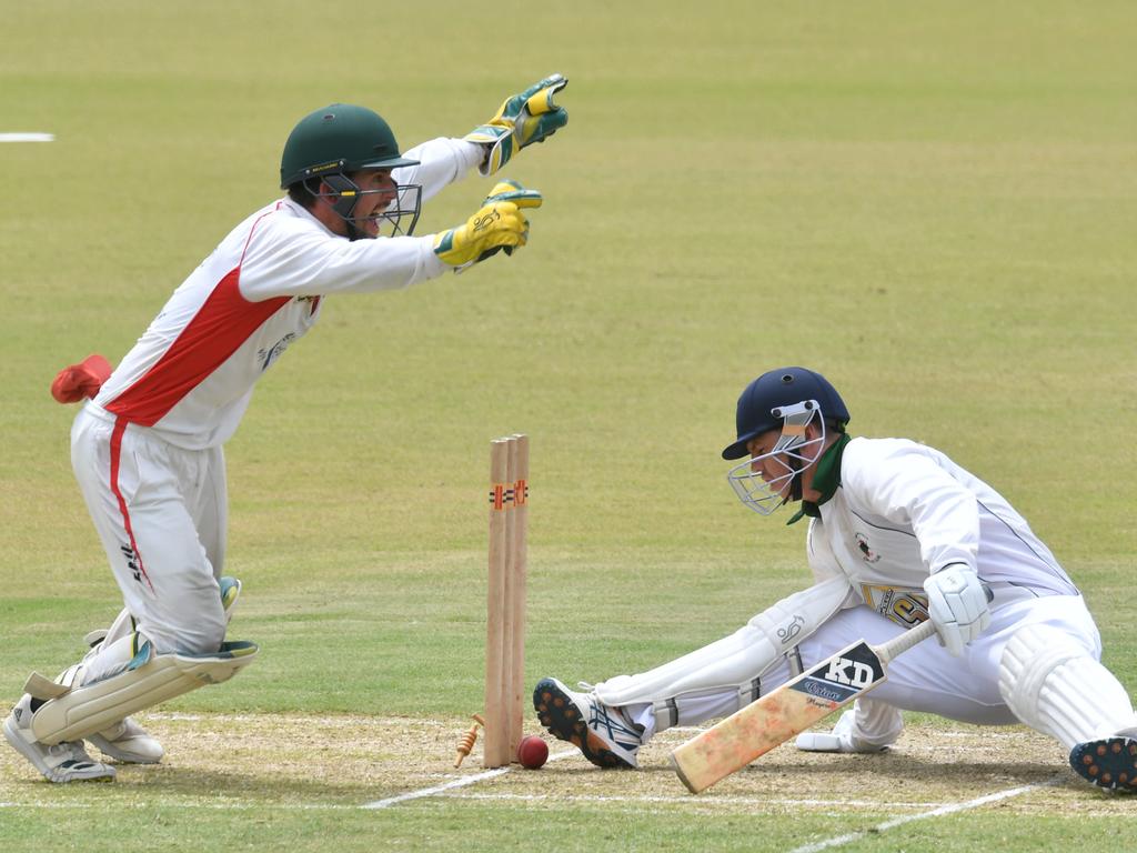 Townsville A Grade cricket game between Norths and Suburban Parks at Riverway Stadium. Norths keeper Adam Zabala watches as Parks Jarrod Green can't stop the ball hitting the stumps. Picture: Evan Morgan