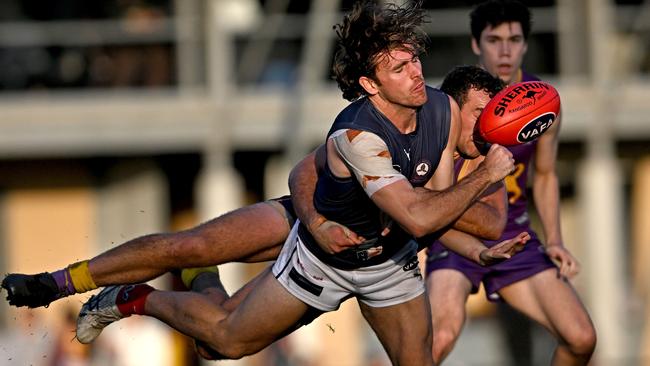 VAFA: Old Melburnians’ Robbie Morrison caught by Max Pinchbeck of Collegians. Picture: Andy Brownbill