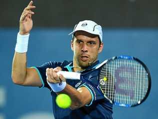 Gilles Muller of Luxembourg returns a shot to Dan Evans of Great Britain at the Sydney International. Picture: DAN HIMBRECHTS