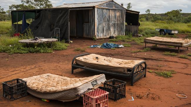 Mattresses outside a tin house at Drive-In Camp. At times residents have moved their beds outside to escape the heat.