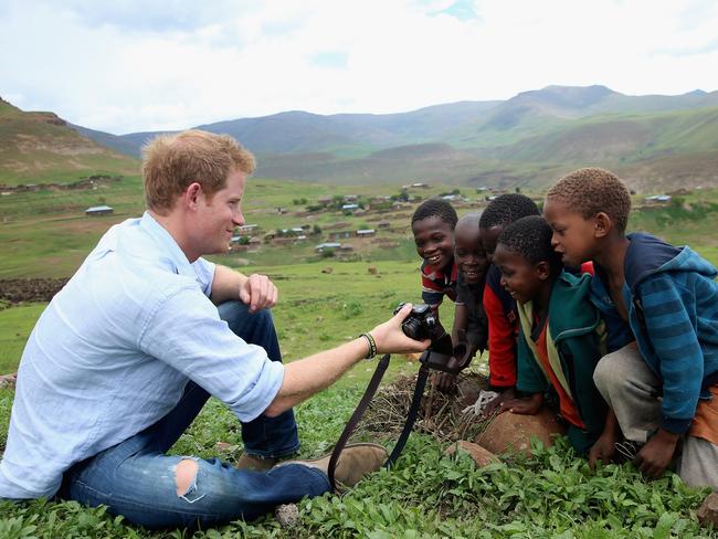 Prince Harry, pictured during a trip to Lesotho in 2014, want to focus their efforts on Africa. Picture: Getty Images