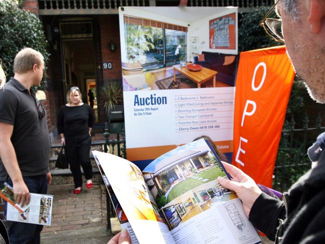 09/08/2009 NEWS: Paola and Michael Incerti look through a catalogue of properties while the home at 90 Taylor Street in Annandale, Sydney is open for inspection to prospective buyers.