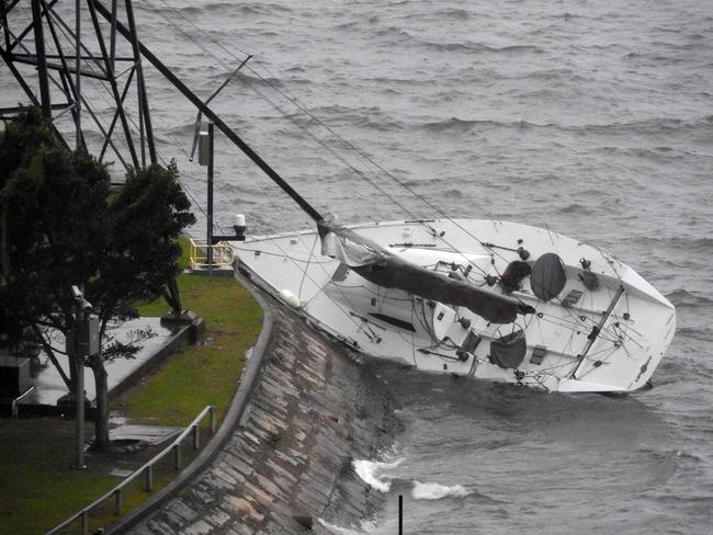 A boat is washed up on the rocks at Elizabeth Bay / Picture: Jonathan Chancellor