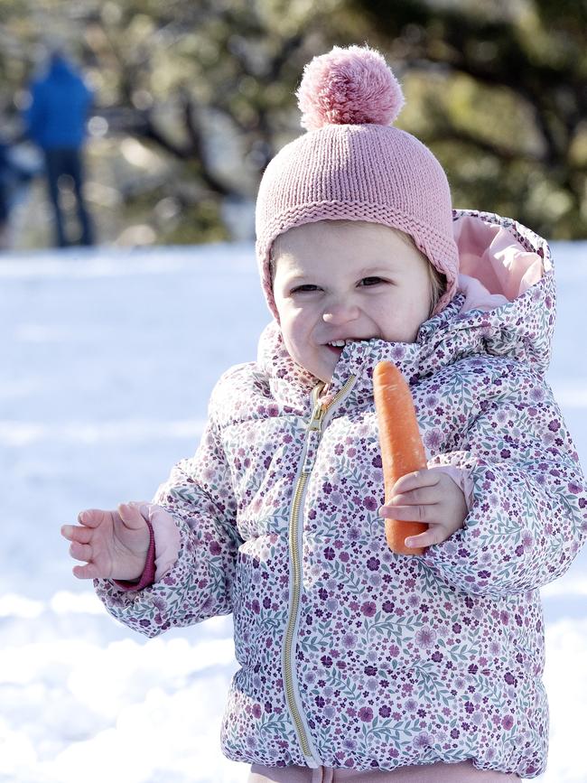 Grace Ratten, of Hobart, enjoys the snow at Fern Tree. Picture: Chris Kidd