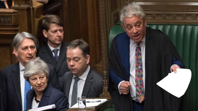 Theresa May passes John Bercow as she enters the Commons. Picture: AFP