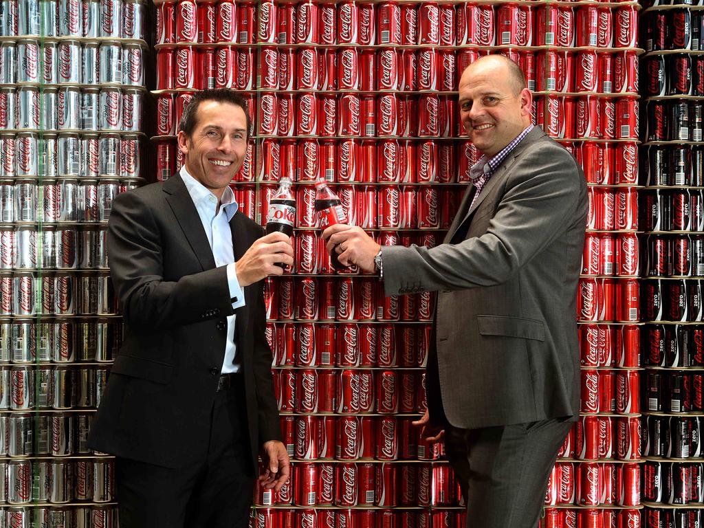 Coca Cola Amatil won the official contract to supply drinks at the new Oval in 2013. CCA’s state manager Rob Priest and Stadium Management Authority Darren Chandler celebrate the result. Picture: Supplied