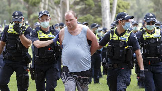 While the rally started peacefully, it ended in chaos, as multiple protesters were led away in cuffs. Picture: NCA NewsWire / David Geraghty