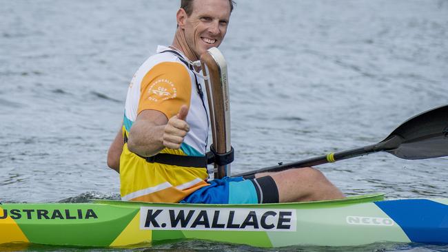 Ken Wallace carrying the Queen’s Baton before the 2018 Gold Coast Commonwealth Games.