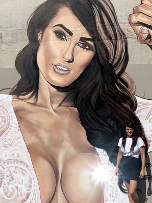 Posing for real: NRL Josh Reynold’s ex, Arabella Del Busso poses beside a mural in Melbourne by graffiti artist, Lushsux