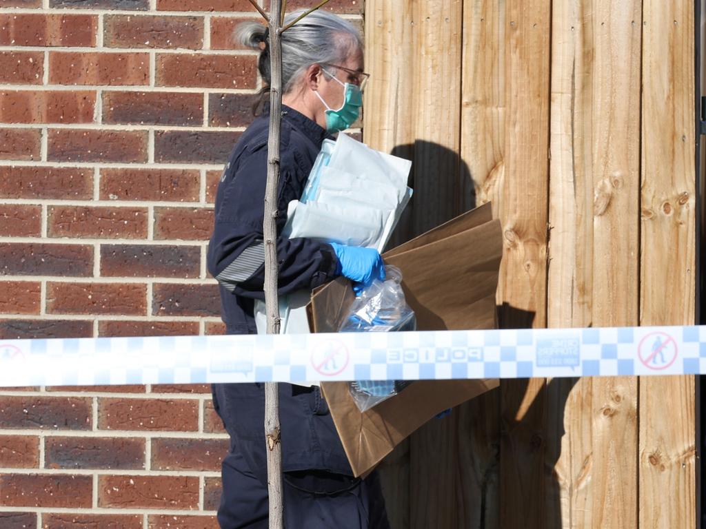 Police at the scene at Mitchell St on Monday. Picture: David Caird