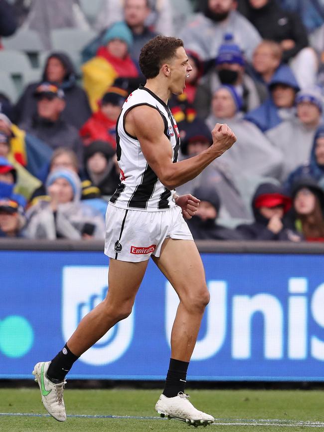 Ash Johnson of the Magpies at the Adelaide Oval, where also seen is LED advertising for UniSA 100% online degrees. Picture: Getty Images