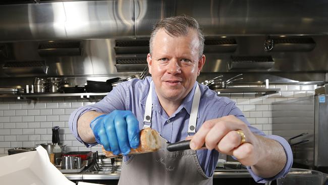 Owner Shannon Kellam of Montrachet preparing food for take away at their restaurant, Brisbane 16th of March 2020.  They're only seating every second table due to the Coronavirus (Covid 19).  (AAP Image/Josh Woning)