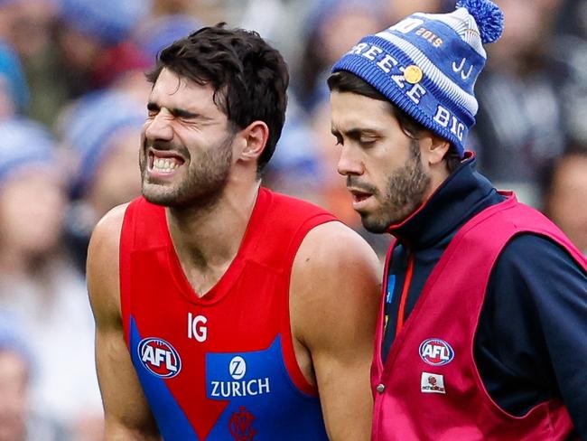 MELBOURNE, AUSTRALIA - JUNE 10: Christian Petracca of the Demons leaves the field injured during the 2024 AFL Round 13 match between the Collingwood Magpies and the Melbourne Demons at The Melbourne Cricket Ground on June 10, 2024 in Melbourne, Australia. (Photo by Dylan Burns/AFL Photos via Getty Images)