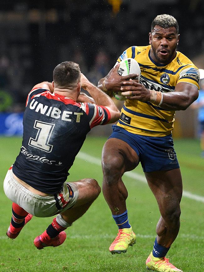 Maika Sivo charges through James Tedesco to score a try. Picture: Dan Himbrechts/AAP